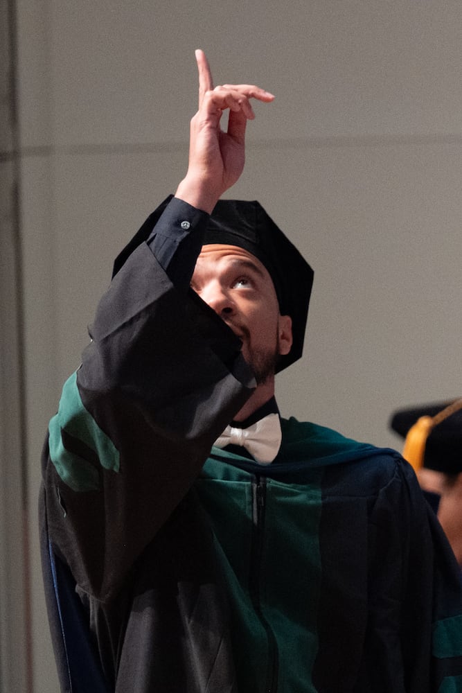 Dr. Dominic Enyart celebrates after receiving his diploma during the Morehouse School of Medicine graduation ceremony on Saturday, May 16, 2026, in Atlanta. (Ben Gray for the AJC)