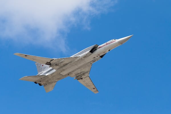 FILE - A TU-22M bomber plane flies over Red Square during a rehearsal for the Victory Day military parade in Moscow, Russia, May 7, 2016. (AP Photo/Alexander Zemlianichenko, File)