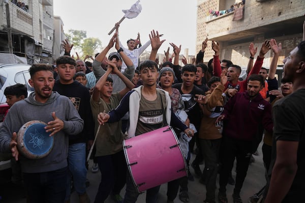 Palestinians chant slogans during an anti-war protest and against Hamas in a rare show of public anger against the militant group that rules the territory, in Beit Lahiya, northern Gaza Strip, Wednesday, March 26, 2025. (AP Photo/Jehad Alshrafi)
