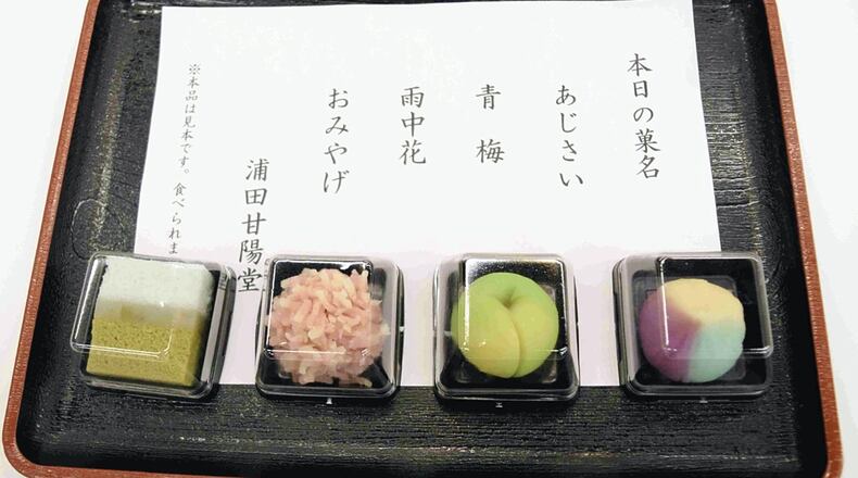 Wagashi made by participants at the workshop in Kanazawa on July 8. From right, “Ajisai (hydrangea),” “Aoume (blue plum),” “Uchuka (flowers in rain)” and “Omiyage (gift).” Photo: Japan News.