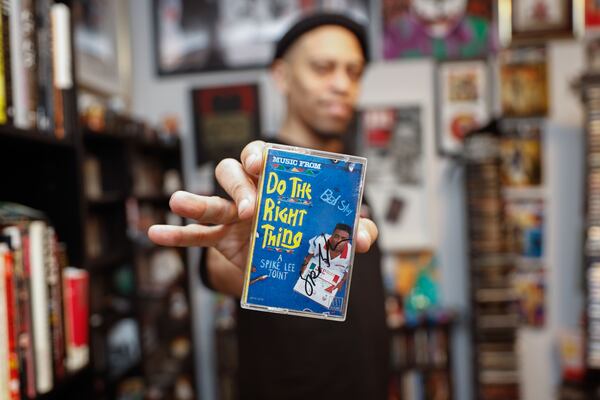 Larry "Nuface" Compton has been collecting magazines, posters, music and Black culture memorabilia since he was a child, including this signed cassette case of Spike Lee's "Do the Right Thing." (Natrice Miller/AJC)