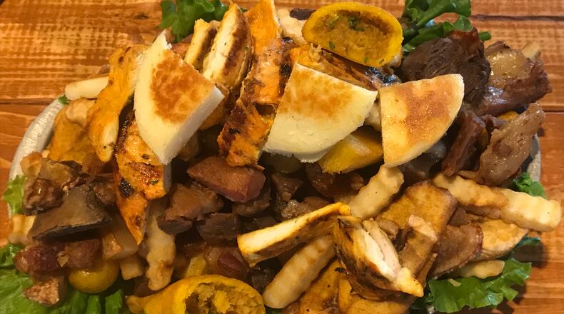 Picada de la Abuela offers a mountain of meat that will please a tableful of hungry carnivores. Photo credit: Ligaya Figueras
