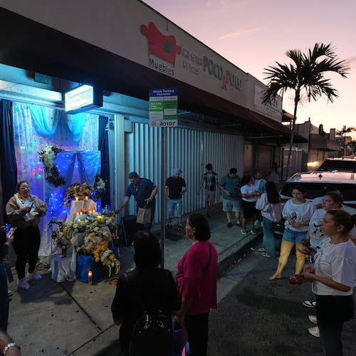 Nicaraguans sing in praise of the Virgin Mary at one of dozens of open-air altars set up near St. John Bosco Catholic Church in celebration of the Dec. 8 feast of the Immaculate Conception, Sunday, Dec. 7, 2025, in Miami. (AP Photo/Rebecca Blackwell)