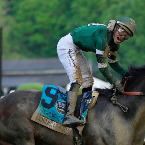 Jockey Jose Ortiz celebrates as he crosses the finish line aboard Golden Tempo (9) to win the 158th running of the Belmont Stakes horse race, Saturday, June 6, 2026, in Saratoga Springs, N.Y. (AP Photo/Yuki Iwamura)