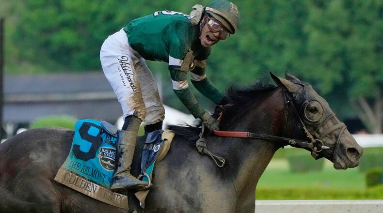 Jockey Jose Ortiz celebrates as he crosses the finish line aboard Golden Tempo (9) to win the 158th running of the Belmont Stakes horse race, Saturday, June 6, 2026, in Saratoga Springs, N.Y. (AP Photo/Yuki Iwamura)