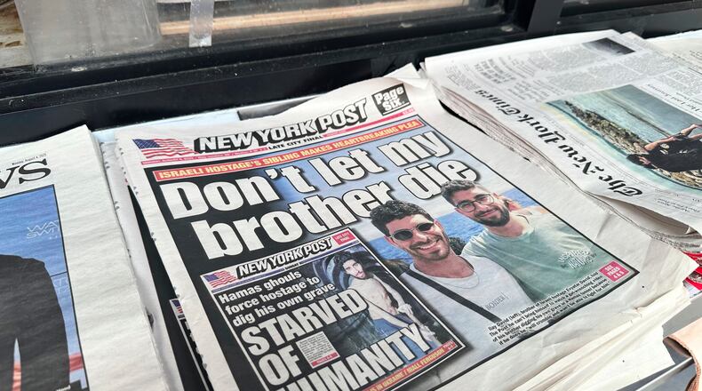 FILE - The New York Post is seen at a newsstand in Manhattan, Aug. 4, 2025. (AP Photo/Jennifer Peltz, File)
