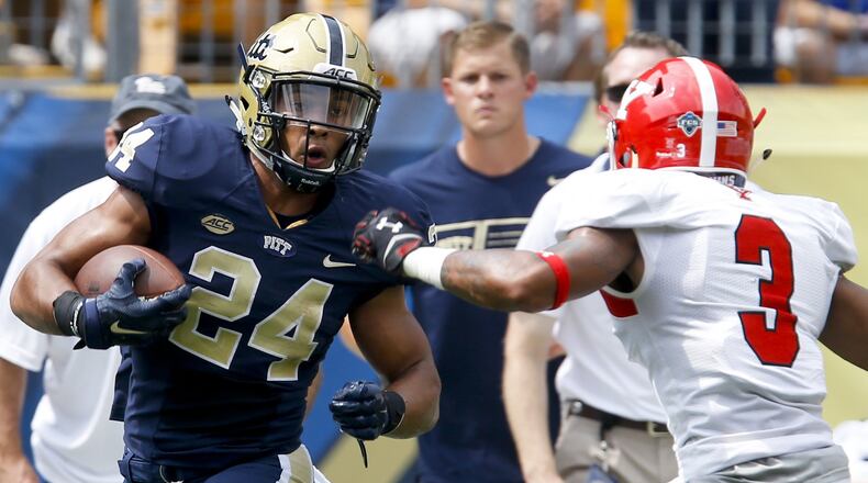 Pittsburgh running back James Conner tries to get past Youngstown State Penguins safety LeRoy Alexander on a long run during an NCAA football game in Pittsburgh. (AP Photo/Keith Srakocic, File)