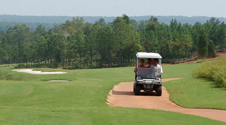 Police say thieves are targeting golfers in Forsyth and Hall counties, stealing items while the players' backs are turned. FILE / 2004 photos