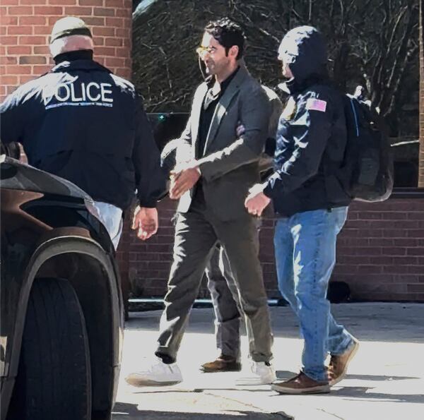 This image taken from a video provided by Christopher Helali shows Mohsen Mahdawi, a Palestinian man who led protests against the war in Gaza as a student at Columbia University, being detained at the U.S. Citizenship and Immigration Services office in Colchester, Vt., on Monday, April 14, 2025. (Christopher Helali via AP)