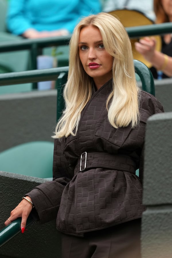 Taylor Fritz's girlfriend, Morgan Riddle, arrives to watch Taylor Fritz of the U.S. playing Jordan Thompson of Australia for the men's singles fourth round match at the Wimbledon Tennis Championships in London, Sunday, July 6, 2025.(AP Photo/Joanna Chan)