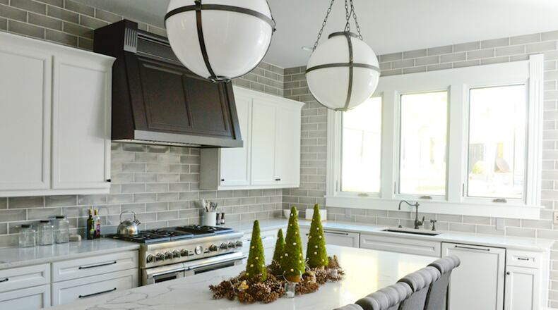 The remodeled kitchen now opens to the dining room, with large casement windows and a big island, and appliances and plumbing from Pirch. Mattison and Smith wanted to renovate this room since they moved in in 2009, but they needed time to decide on the design. They finally completed the changes in 2015. "We are more than happy that we waited to 'get it right,'" said Mattison, an interior designer.