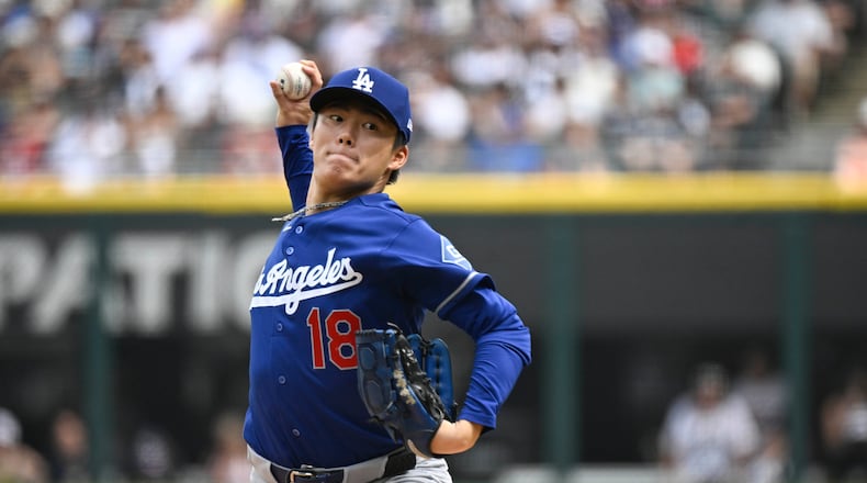 Los Angeles Dodgers pitcher Yoshinobu Yamamoto, of Japan, delivers during the first inning of a baseball game against the Chicago White Sox, Saturday, June 13, 2026, in Chicago. (AP Photo/Matt Marton)