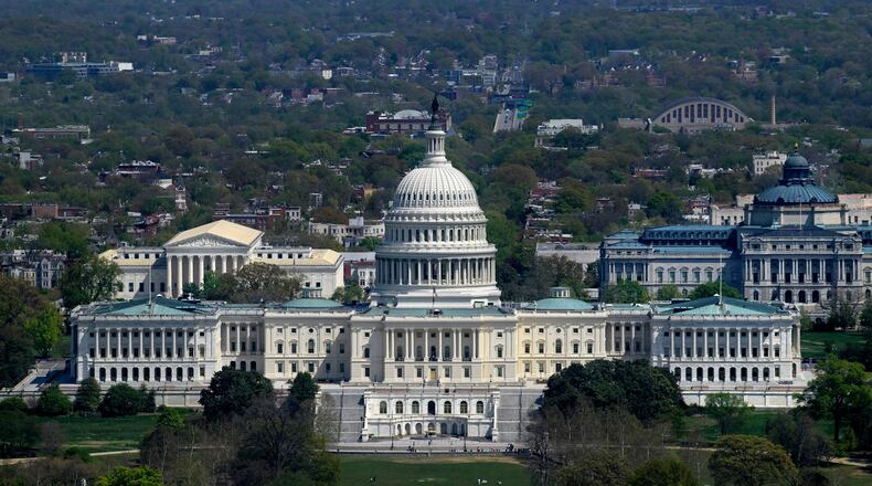 The U.S. Capitol, center, is seen with the Supreme Court of the United States, left, and the Library of Congress, right, Thursday, April 9, 2026, in Washington. (AP Photo/Rod Lamkey, Jr.)