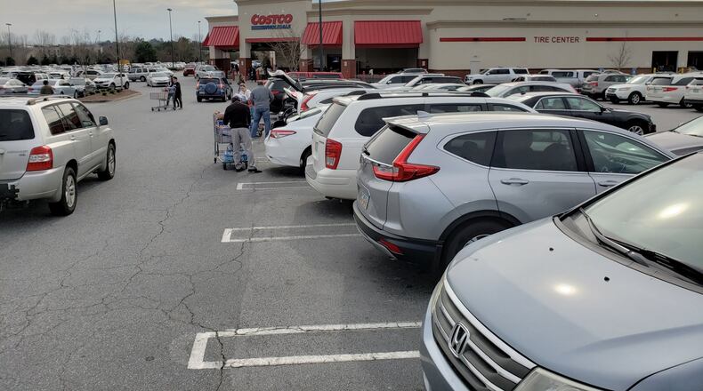 Concerns about the new coronavirus and increasing cases in the United States pushed some metro Atlanta shoppers to stock up on food, water and other supplies in recent days, including at a Costco in Buford in Gwinnett County. MATT KEMPNER / AJC