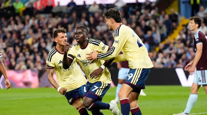 Arsenal's Bukayo Saka (7) celebrates after scoring his side's opening goal during the English Premier League soccer match between Aston Villa and Arsenal in Birmingham, England, Monday, Aug. 31, 2026. (Nick Potts/PA via AP)