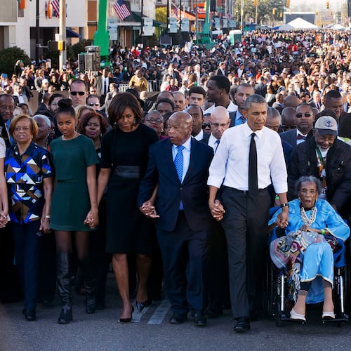 John Lewis returned every year to Selma to walk across the Edmund Pettus Bridge. In 2015, he commemorated the 50th anniversary of Bloody Sunday by joining hands with President Barack Obama and his family and leading a march. Other survivors of Bloody Sunday helped lead the procession. The event included a rare joint appearance by Obama and President George W. Bush, who also attended. (Jacquelyn Martin/AP)