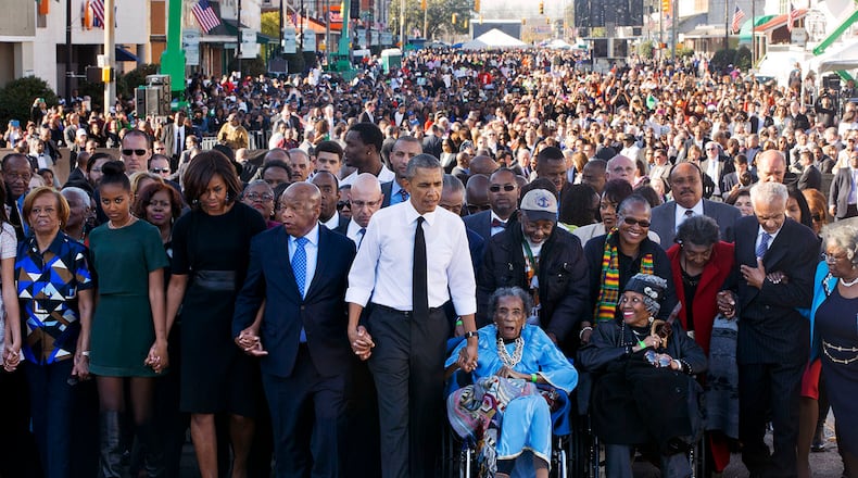 John Lewis returned every year to Selma to walk across the Edmund Pettus Bridge. In 2015, he commemorated the 50th anniversary of Bloody Sunday by joining hands with President Barack Obama and his family and leading a march. Other survivors of Bloody Sunday helped lead the procession. The event included a rare joint appearance by Obama and President George W. Bush, who also attended. (Jacquelyn Martin/AP)