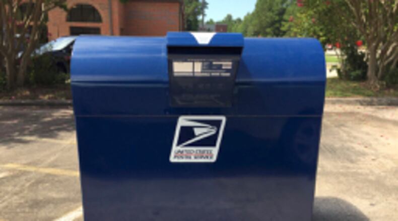 Despite reports of thefts from the outdoor mailbox at the Peachtree City post office, the box remains open for use. Jill Howard Church for the AJC