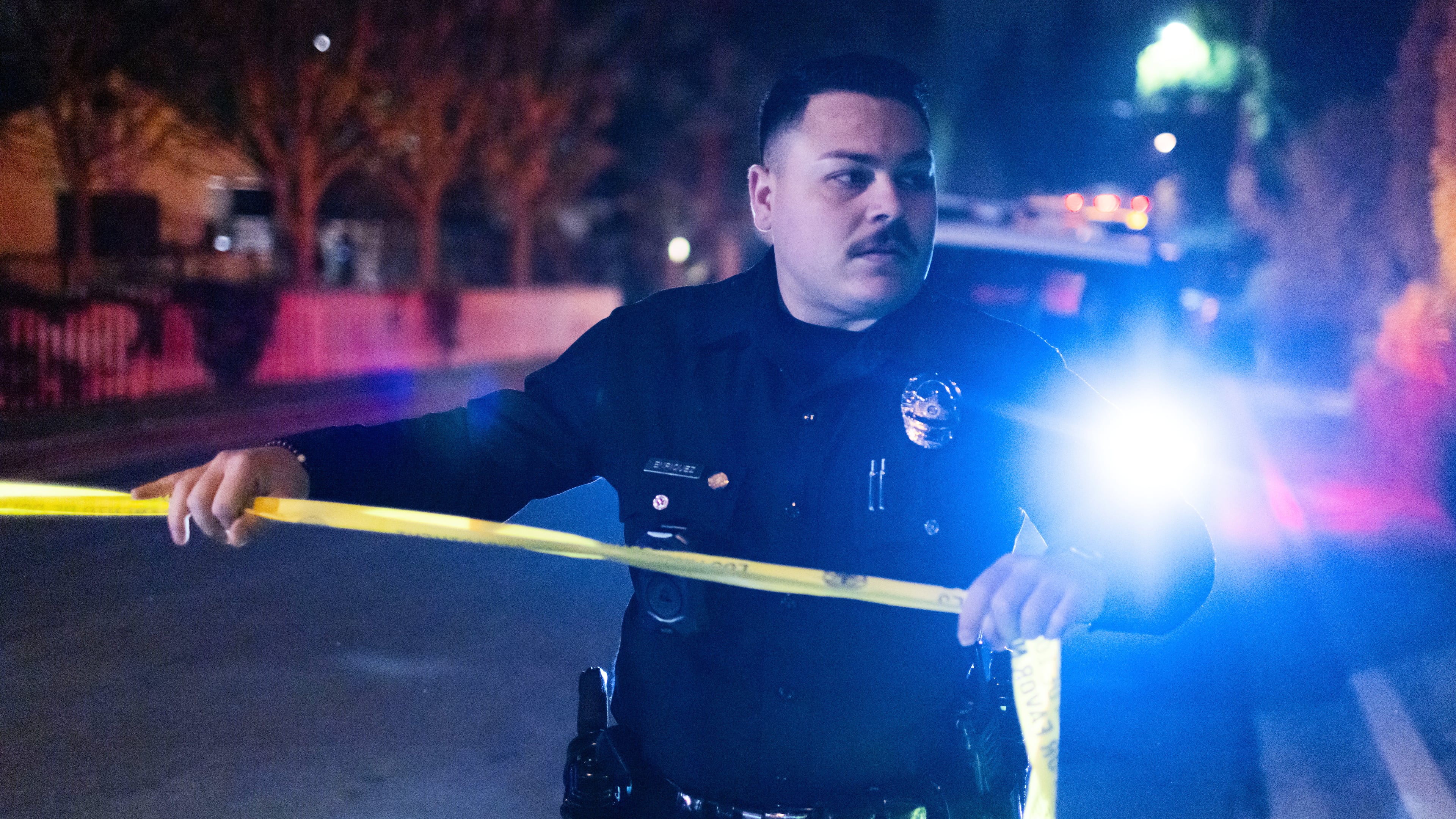 A police officer blocks off a street near Rob Reiner's residence Sunday, Dec. 14, 2025, in the Brentwood section of Los Angeles. (AP Photo/Ethan Swope)