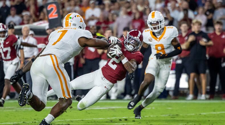 FILE - Alabama wide receiver Ryan Williams (2) grabs a pass in front of Tennessee linebacker Arion Carter (7) during the first half of an NCAA college football game, Oct. 18, 2025, in Tuscaloosa, Ala. (AP Photo/Vasha Hunt, File)