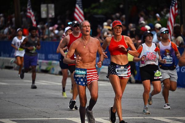 Thousands ran in the heat and humidity to participate in the Peachtree Road Race on July 4th. (Hyosub Shin/AJC)