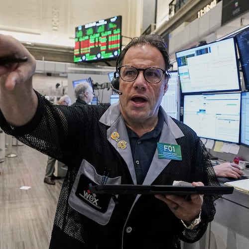 Options trader Anthony Spina works on the floor of the New York Stock Exchange, Friday, Nov. 21, 2025. (AP Photo/Richard Drew)