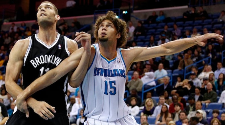 Brooklyn Nets center Brook Lopez (11) and New Orleans Hornets center Robin Lopez (15) go for a rebound on Feb. 26, 2013 at the New Orleans Arena in New Orleans, La. (Jonathan Bachman/Cal Sport Media/Zuma Press/TNS)