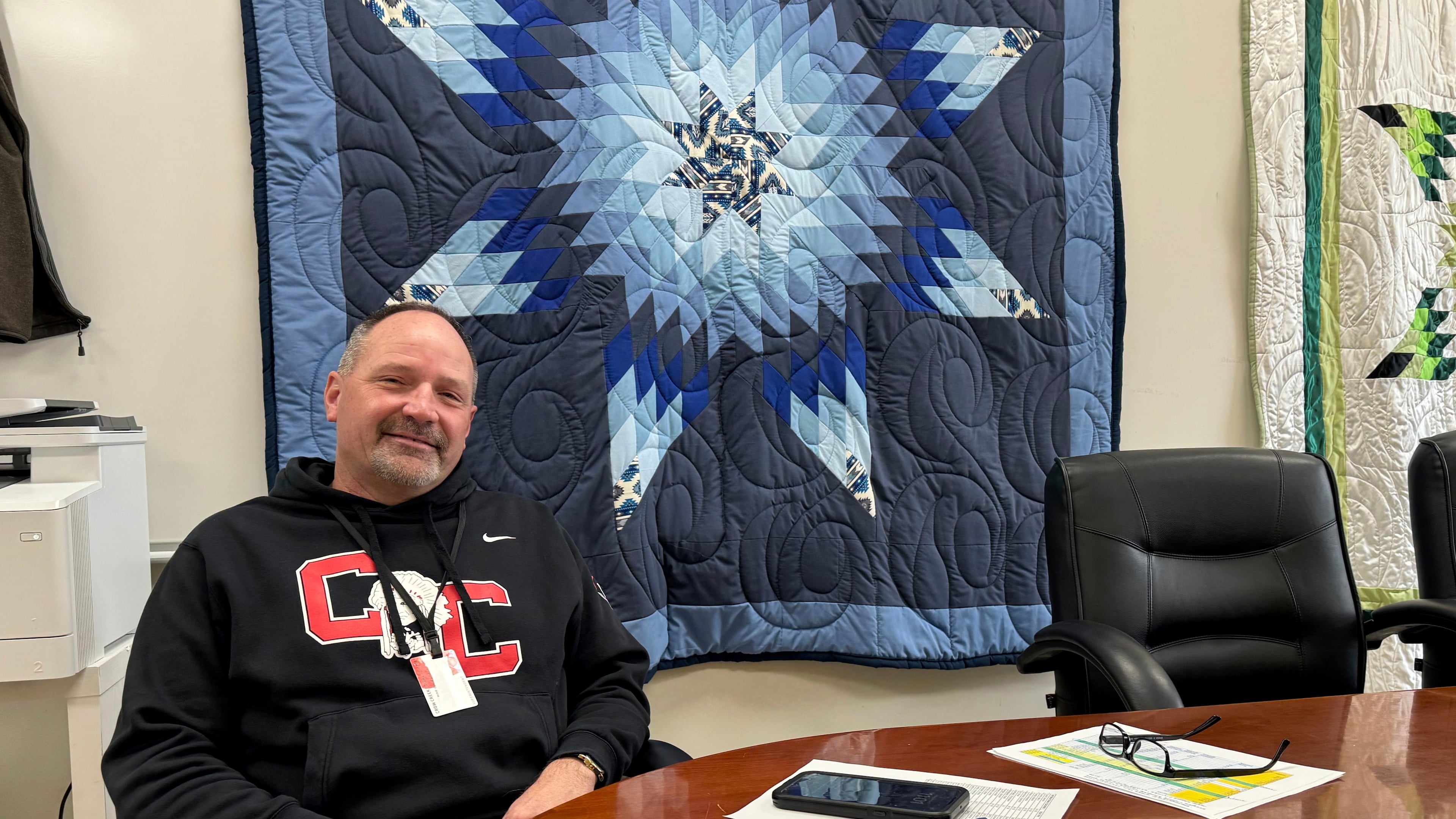 In this photo provided by South Dakota News Watch, Rob Coverdale, superintendent of the Crow Creek Tribal School District in Stephan, S.D., poses for a photo in his office, Feb. 7, 2025. (Bart Pfankuch/South Dakota News Watch via AP)