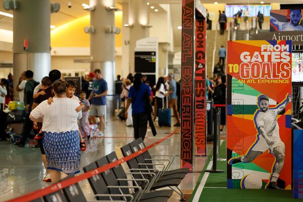 Travelers at Hartsfield-Jackson Atlanta International Airport as Atlanta prepared to host the FIFA World Cup on Sunday, June 14, 2026. 
 (Miguel Martinez/AJC)