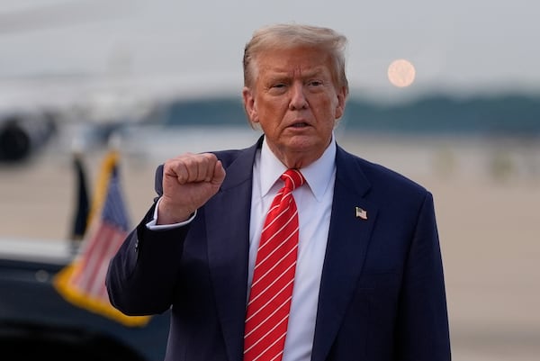 President Donald Trump gestures after arriving on Air Force One, Wednesday, June 25, 2025, at Joint Base Andrews, Md. (AP Photo/Alex Brandon)