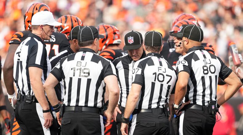 FILE - Referee Clay Martin (19), far left, talks with the officiating crew during an NFL football game between the Arizona Cardinals and the Cincinnati Bengals, Sunday, Dec. 28, 2025, in Cincinnati. (AP Photo/Kareem Elgazzar, file)