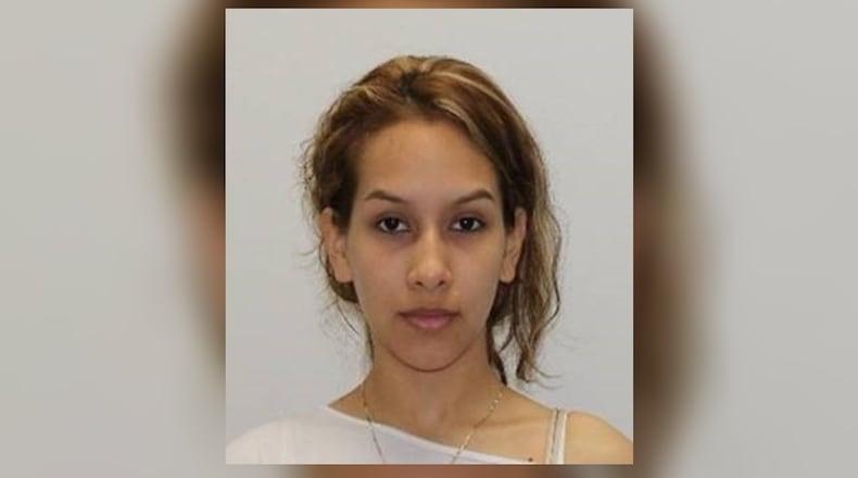 Maria Katherine Chavez Encarnacion, 28, of Marietta, is wanted on a murder charge in the slaying of Rossana Delgado. Authorities believe Encarnacion may be in Mexico.