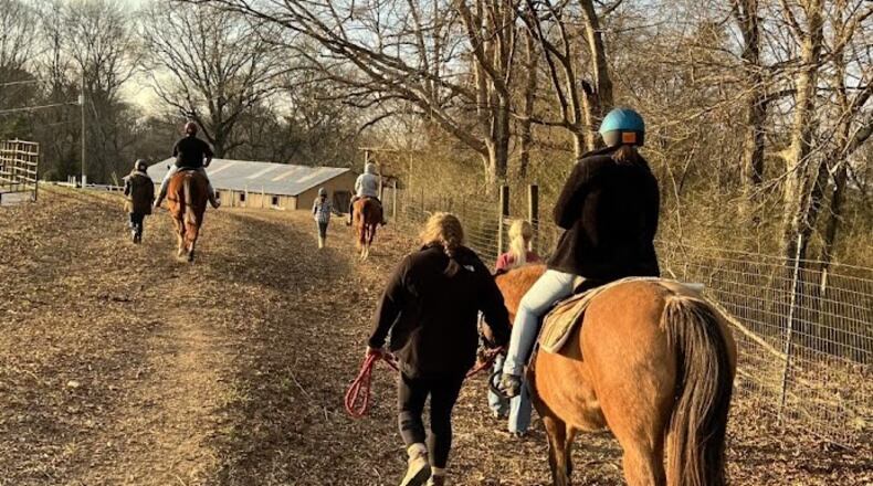 Residents of Murphy Harpst Children's Center return from a ride. Equine therapy is an essential part of its therapeutic services.
Courtesy of Murphy Harpst Children's Center