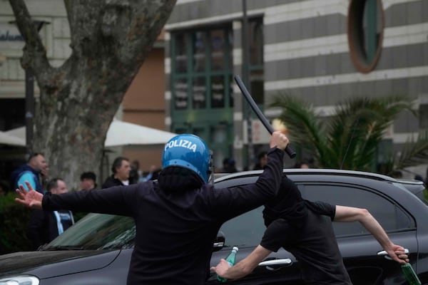 Lazio fans riot with Police ahead of the Italian Series A soccer match between Lazio and Roma outside Rome's Olympic stadium, Sunday, April 13, 2025. (AP Photo/Gregorio Borgia)