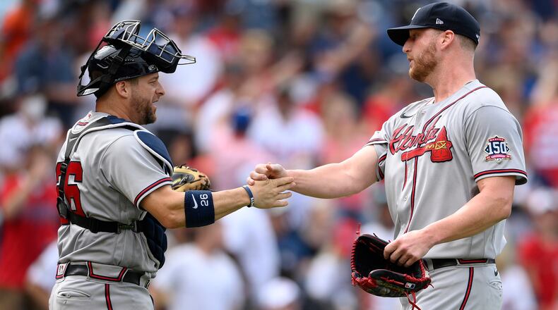 Braves reliever Will Smith (right) celebrates with catcher Stephen Vogt after 6-5 win over the Washington Nationals, Sunday, Aug. 15, 2021, in Washington. (Nick Wass/AP)