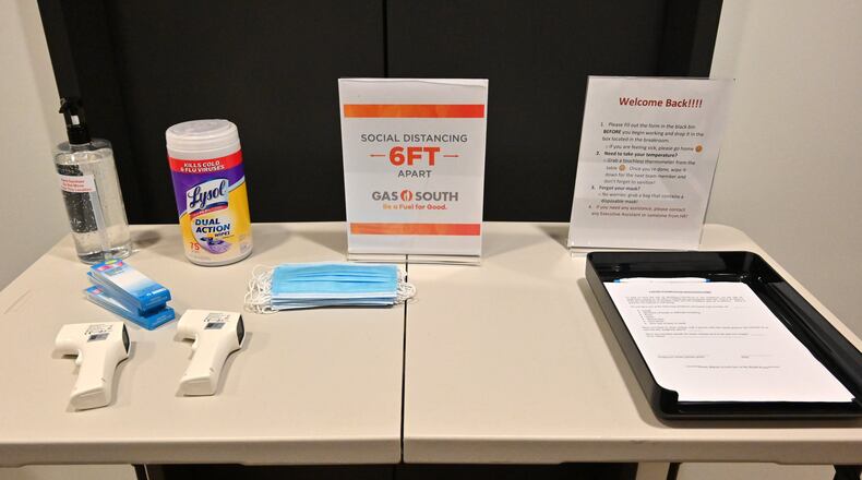 A self-check-in desk has been set up on each floor for employees who want to come in for work at Gas South headquarters on Wednesday, June 24, 2020. The restart of the economy is often doing so without a big return to cubicles, shared desks and many of the other trappings of corporate life. (Hyosub Shin / Hyosub.Shin@ajc.com)