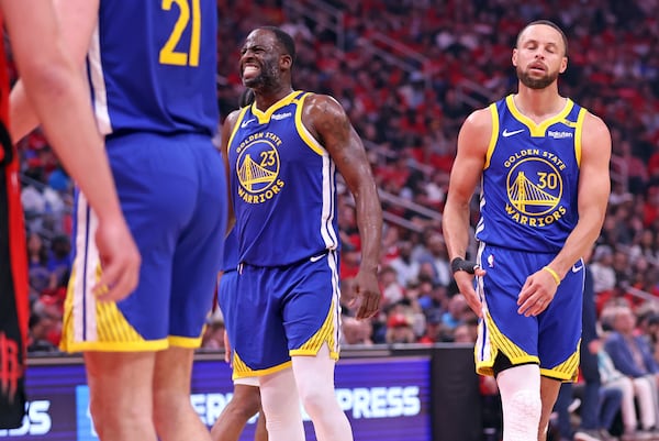 Golden State Warriors' Draymond Green and Stephen Curry react to a missed free throw by Green in the first quarter against the Houston Rockets in Game 2 of the first round of NBA Playoffs at Toyota Center in Houston, on Wednesday, April 23, 2025. (Scott Strazzante/San Francisco Chronicle via AP)