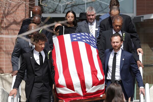 Peyton Love, front left, and Jason Love, front right, carry the casket of their mother and wife, former U.S. Rep. Mia Love, to a hearse after her memorial service at The Church of Jesus Christ of Latter-day Saints on the University of Utah campus in Salt Lake City, Monday, April 7, 2025. (AP Photo/Melissa Majchrzak)