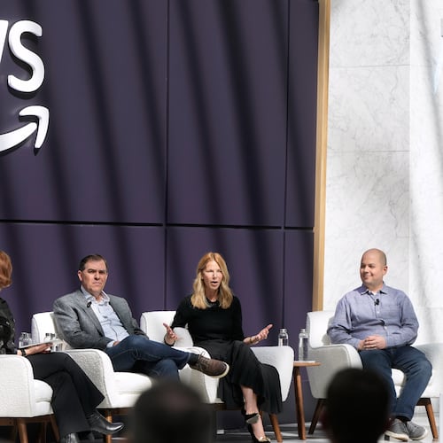 Denise Dresser, chief revenue officer of OpenAI, second right, speaks on stage with Julia White, vice president & chief marketing officer, AWS, from left, Matt Garman, CEO of AWS, and Anthony Liguori, vice president and distinguished engineer, AWS, at a What's Next with AWS event, Tuesday, April 28, 2026, in San Francisco. (AP Photo/Jeff Chiu)