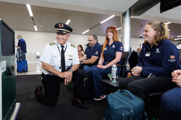 Delta pilot Mike Cheri meets with the Auburn University Raptor Center team ahead of a flight to Philadelphia at the Hartsfield-Jackson Atlanta International Airport on July 3, 2026. (Estela Muñoz/AJC) 