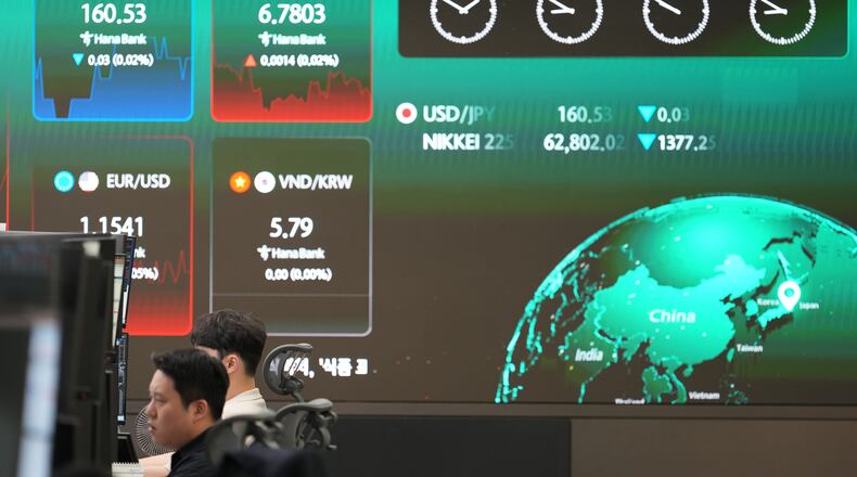 A screen shows foreign exchange rates at a dealing room of Hana Bank in Seoul, South Korea, Thursday, June 11, 2026. (AP Photo/Lee Jin-man)
