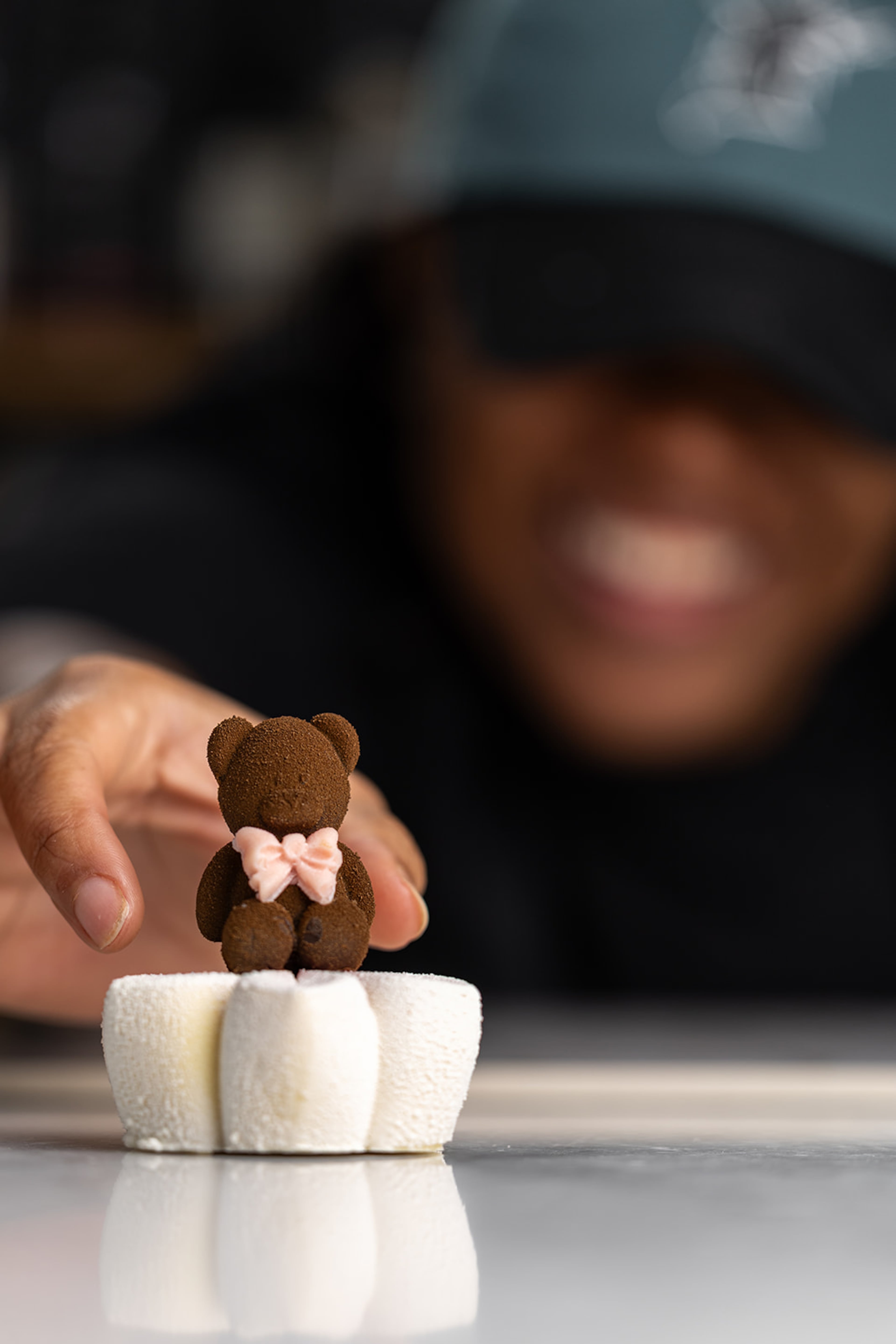 Chef Tamara Hewitt's teddy bear truffle on top of a red velvet flower at Peckish in Pullman Yards. (Courtesy of Atlanta Creative Media/Peckish)