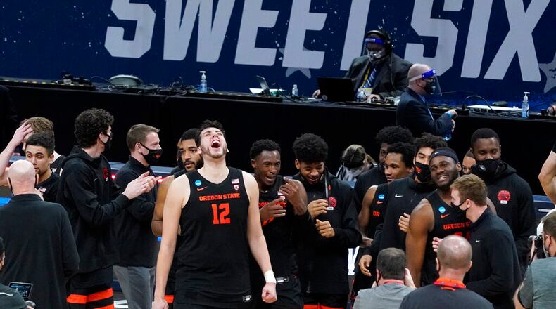 Oregon State center Roman Silva (12) celebrates after a Sweet 16 game against Loyola Chicago in the NCAA men's college basketball tournament at Bankers Life Fieldhouse, Saturday, March 27, 2021, in Indianapolis. Oregon State won 65-58. (AP Photo/Jeff Roberson)