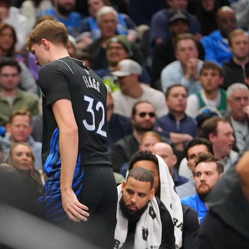 Dallas Mavericks forward Cooper Flagg leaves the court and heads to the locker room during the first half of an NBA basketball game against the Denver Nuggets Wednesday, Jan. 14, 2026, in Dallas. (AP Photo/Julio Cortez)