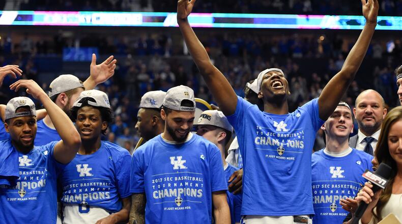 Kentucky players celebrate after beating Arkansas in an NCAA college basketball game for the championship of the Southeastern Conference tournament Sunday, March 12, 2017, in Nashville, Tenn. Kentucky won 82-65. (AP Photo/Sanford Myers)