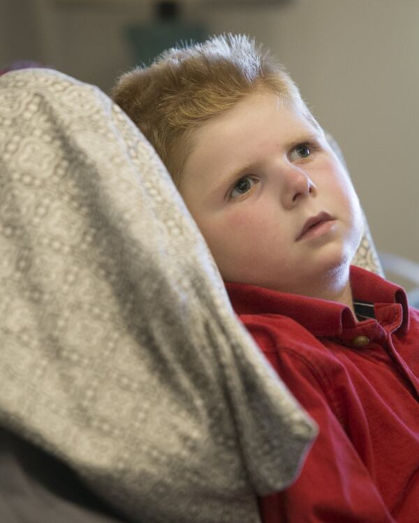 Tripp Halstead is unable to walk or talk, but he’s begun to show emotions. (CASEY SYKES, CASEY.SYKES@AJC.COM)