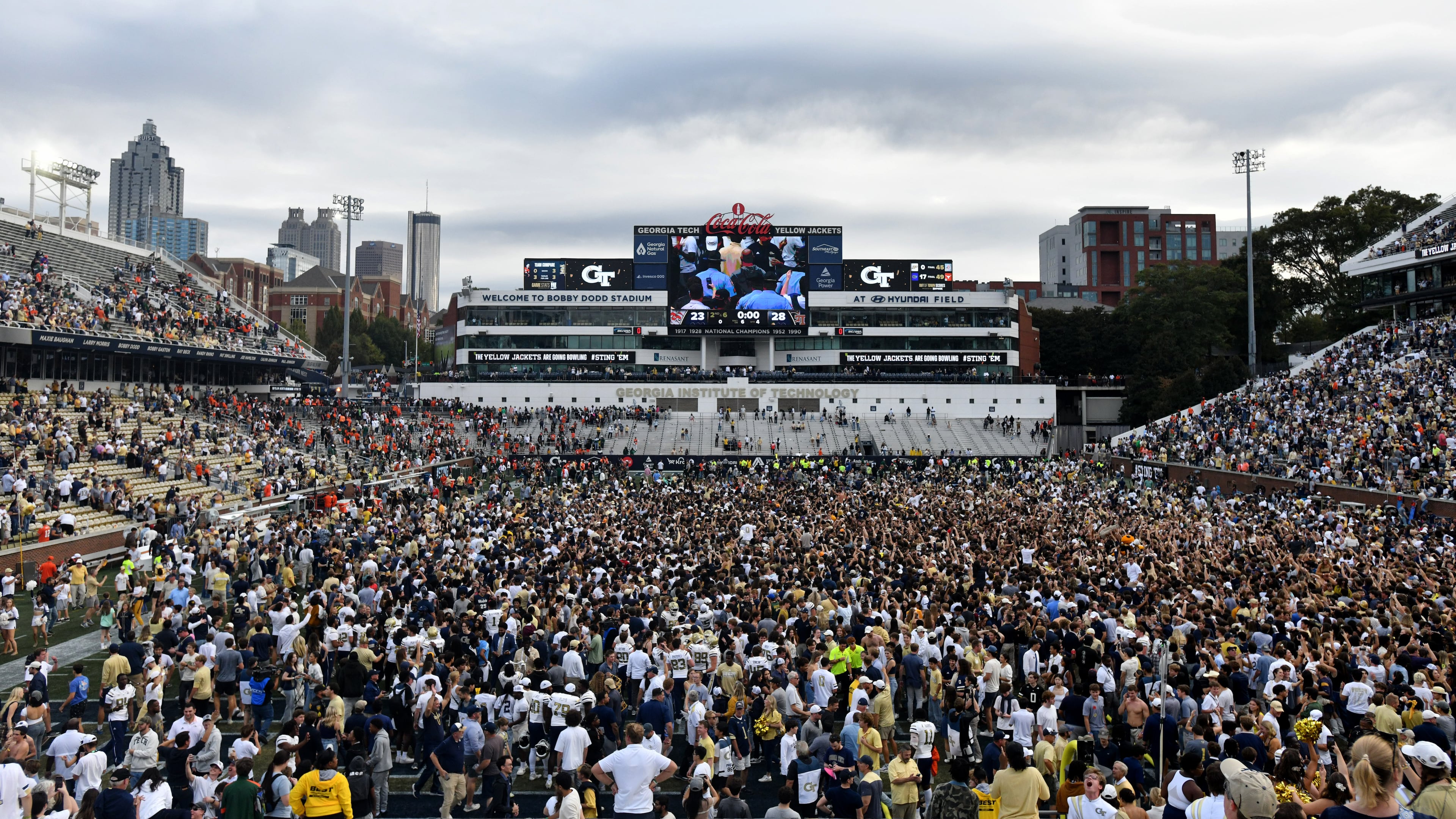 Georgia Tech fans storm the field after an NCAA college football game against Miami at Georgia Tech's Bobby Dodd Stadium, 2024, in Atlanta. (Hyosub Shin/AJC)