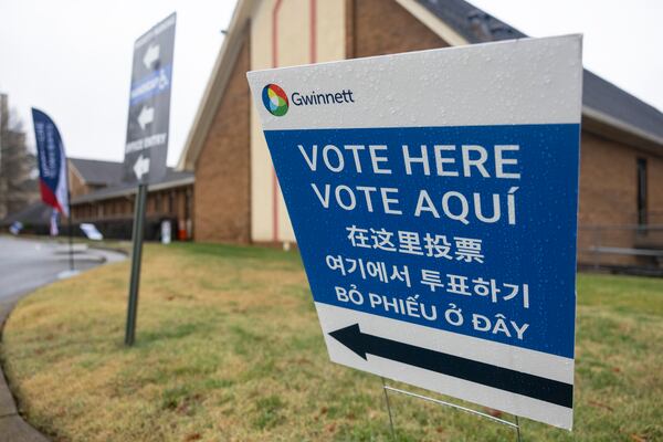 Signs in Lawrenceville last year were in several languages to assist voters. (Jason Getz/AJC)