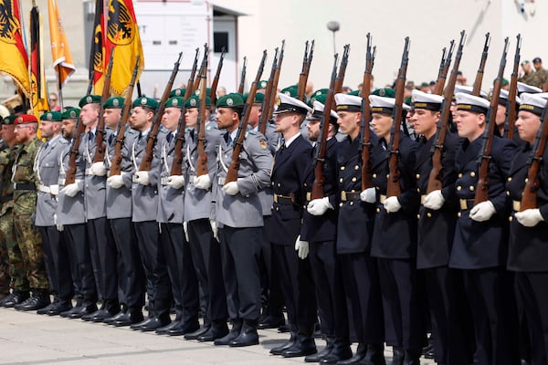German soldiers march at the formal inauguration of a German brigade for NATO's eastern flank in the center of Vilnius, Lithuania, Thursday, May 22, 2025. (AP Photo/Mindaugas Kulbis)