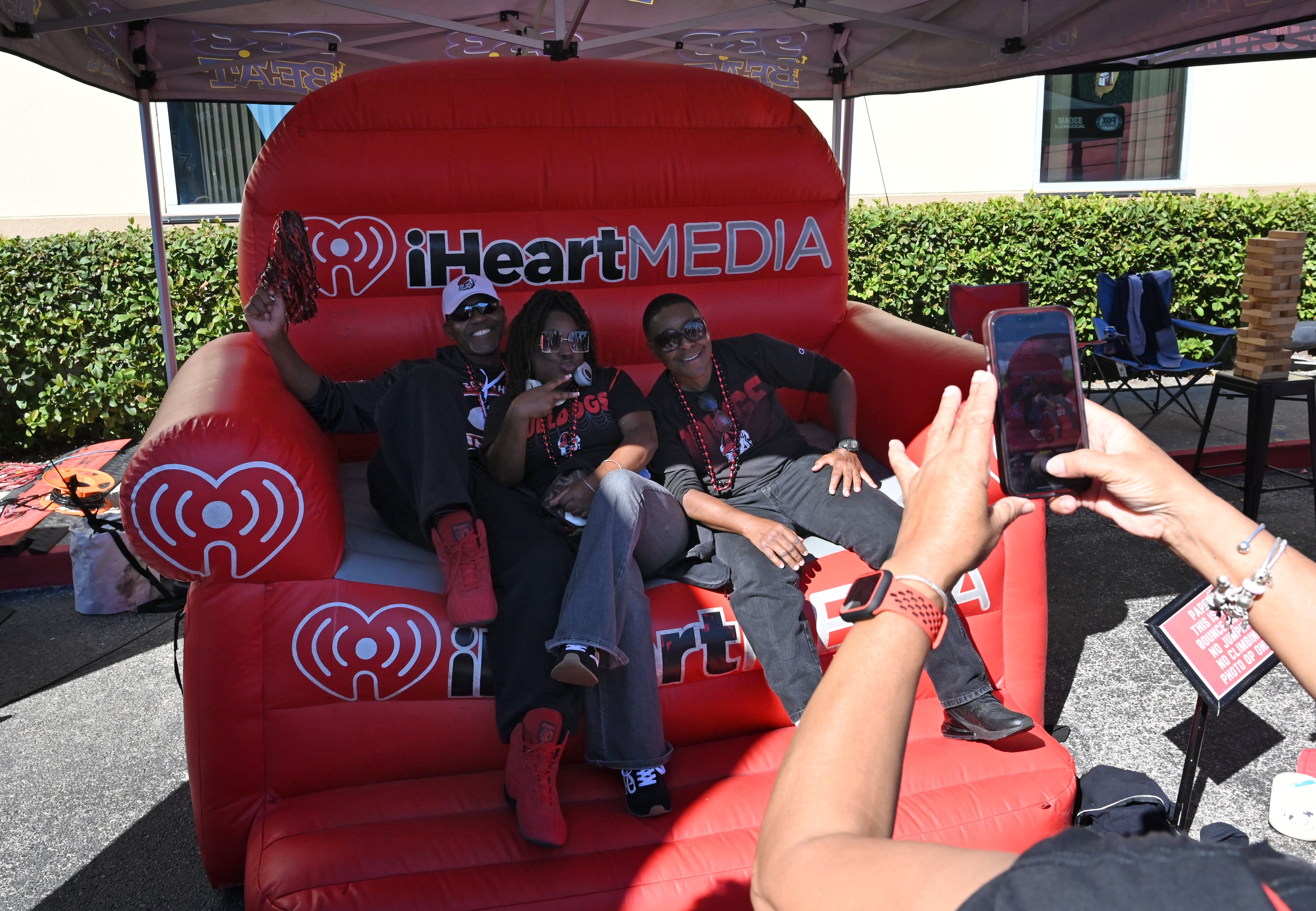 Georgia fans pose at the Tailgate Tour prior to an NCAA football game between Georgia and Florida, Saturday, Nov. 1, 2025, Jacksonville, Fla. (Hyosub Shin / AJC)